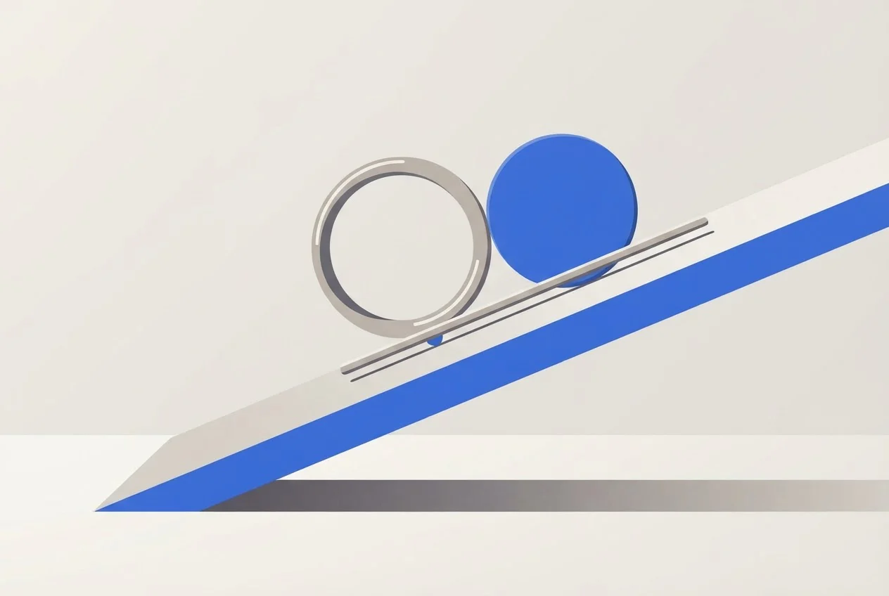 A hollow ring and a solid disc held side by side at the top of a tilted ramp before being released.